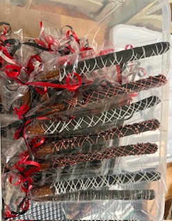 Individually wrapped chocolate-covered pretzel rods