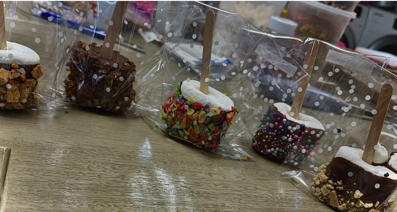 Chocolate-covered marshmallow treats with assorted toppings