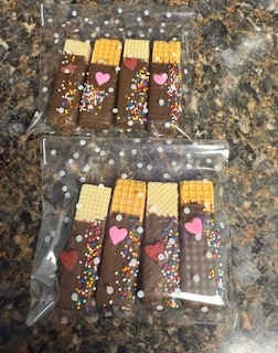 Wrapped chocolate-dipped cookies with colorful decorations